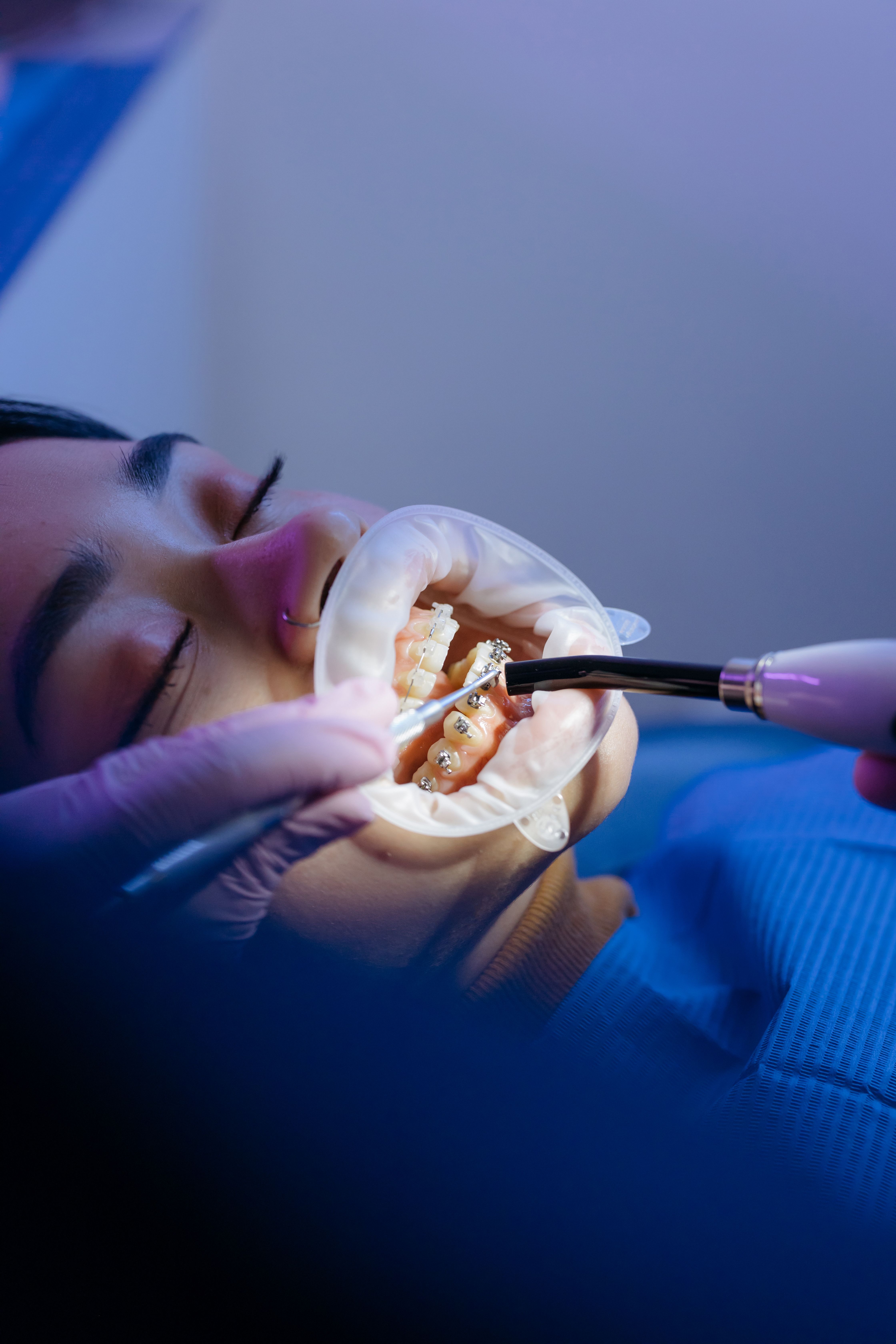 Dental professional with patient in modern office